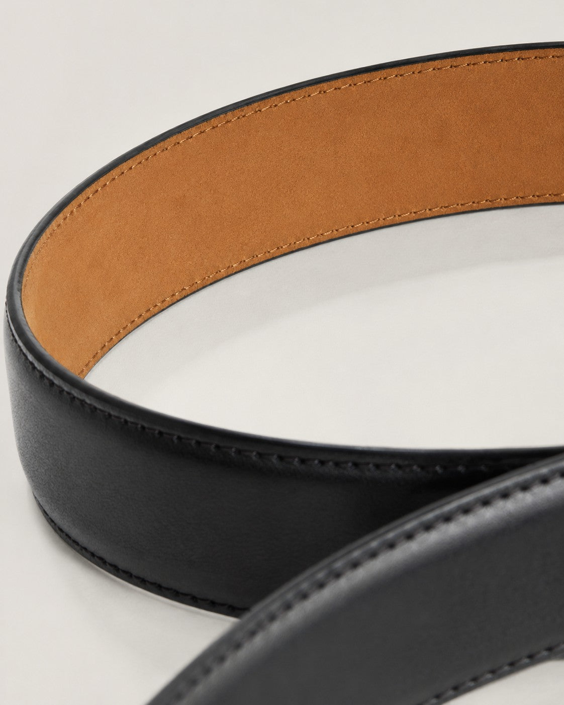 Macro crop of the tan nubuck lining inside a Harrow belt
